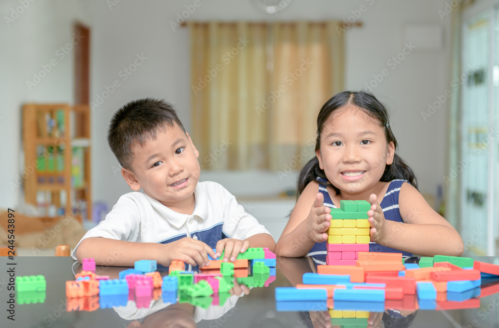 sister and brother play wood brick tower, sister and brother play wood brick tower,