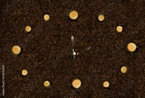 Hours from black mugs of coffee with on coffee beans. Hours from coffee. The concept time from food