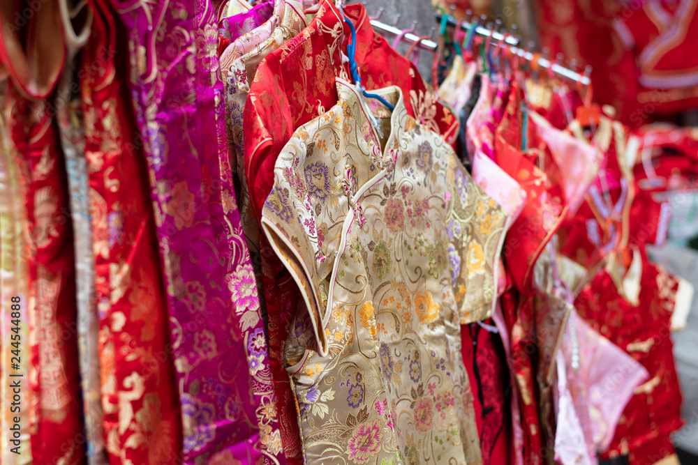 Various and many of Chinese cloth cheongsam selling at street market before Chinese New Year Day.