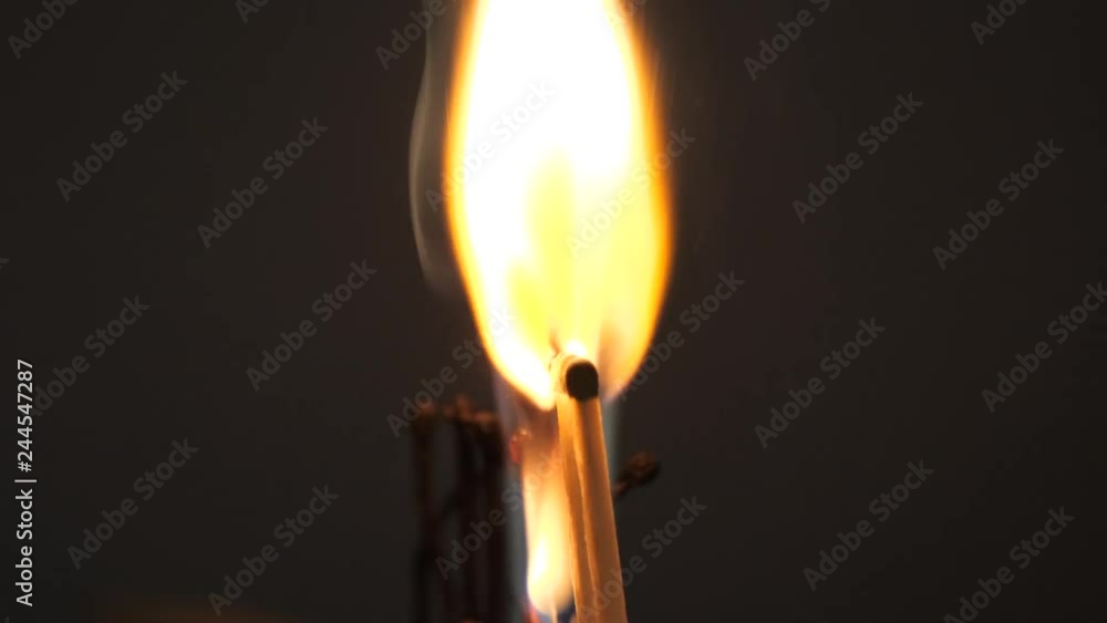 matches sulfur burn with a red flame on a dark background matches sulfur burn with a red flame on a dark background