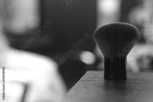 closeup of whisk  cosmetic brush  beauty salon concept background. tools in details  black and white
