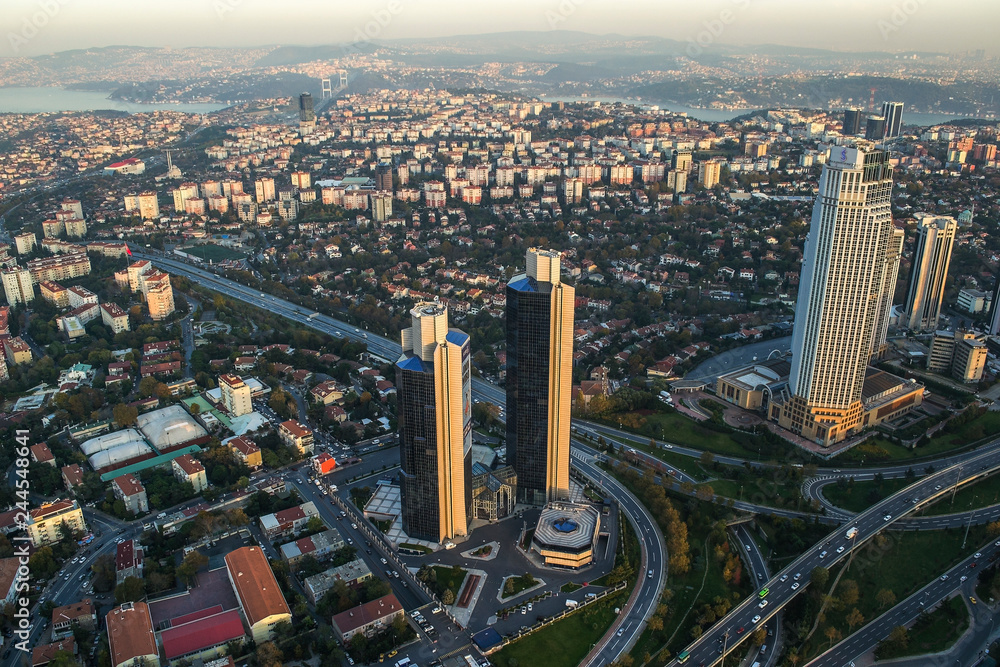 Fototapeta premium ISTANBUL, TURKEY - AUGUST 23: Skyscrapers and modern office buildings at Levent District. With Bosphorus background. August 23, 2014 in Istanbul, Turkey.