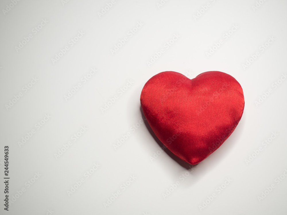 Simple classic red silk handmade heart on white background Simple classic red silk handmade heart on white background