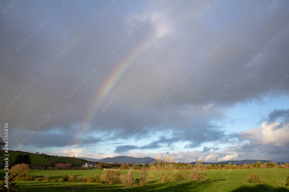 Rainbow over a farmers field in the South West of Ireland Rainbow over a farmers field in the South West of Ireland