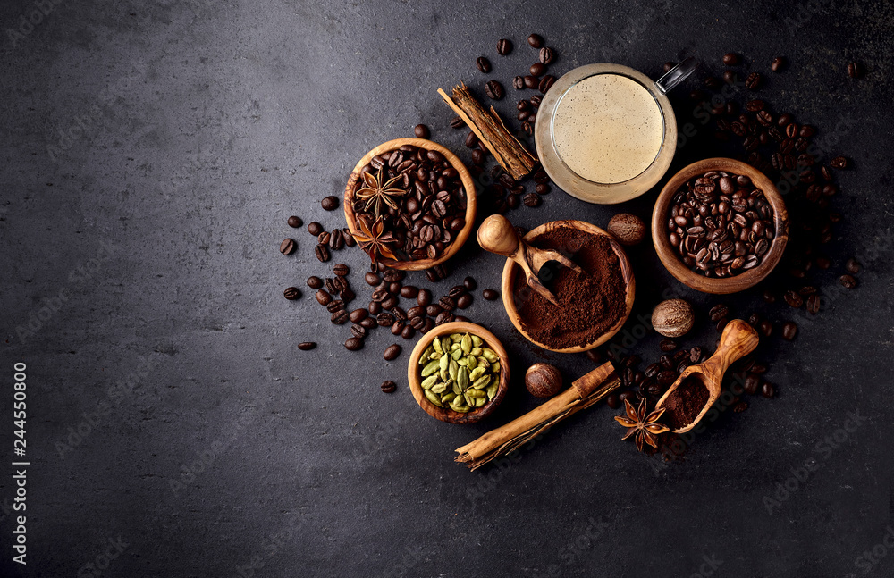 Coffee, anise, cardamon and nutmeg on black background. Coffee, anise, cardamon and nutmeg on black background.