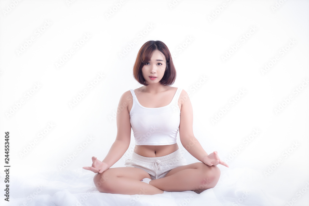 Woman has meditating on white background, Meditation has great calming effects and to recharge more energy throughout the day. Woman has meditating on white background, Meditation has great calming effects and to recharge more energy throughout the day.
