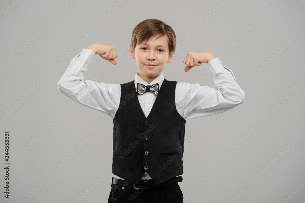 Little boy bragging about biceps Little boy bragging about biceps