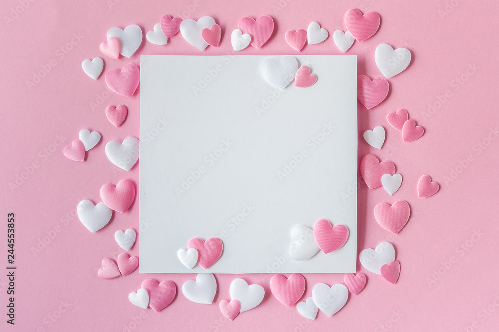 Valentines day concept. Greeting card with a pink and white hearts and space for text on a pink background. Top view. Flat lay.