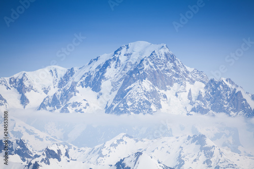 Beautiful view of snow Mont Blanc peaks and clouds photo
