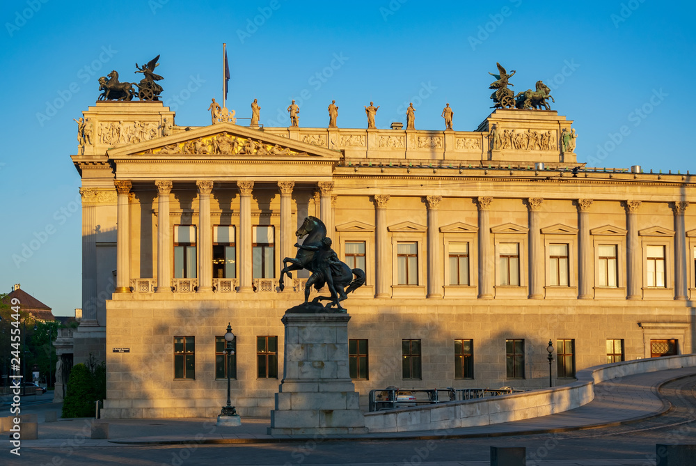 Right side of Parliament building in Vienna, Austria in sunrise light