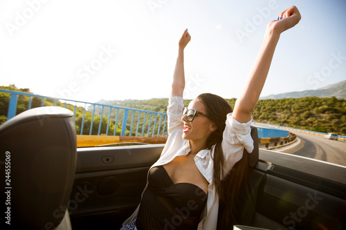 Young attractive woman driv...