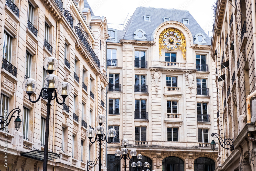 Tall French building with a giant clock