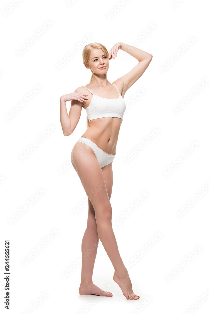 full length view of beautiful slim girl in underwear posing and looking away isolated on white full length view of beautiful slim girl in underwear posing and looking away isolated on white