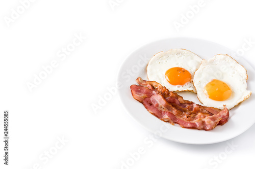 Fried eggs and bacon for breakfast isolated on white background. Copyspace

