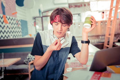 Photography Teenager taking vitamin D pills while preparing for the exam
