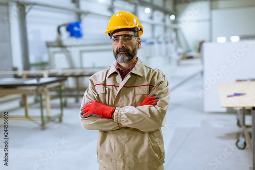 Portrait of middle-aged engineer in factory