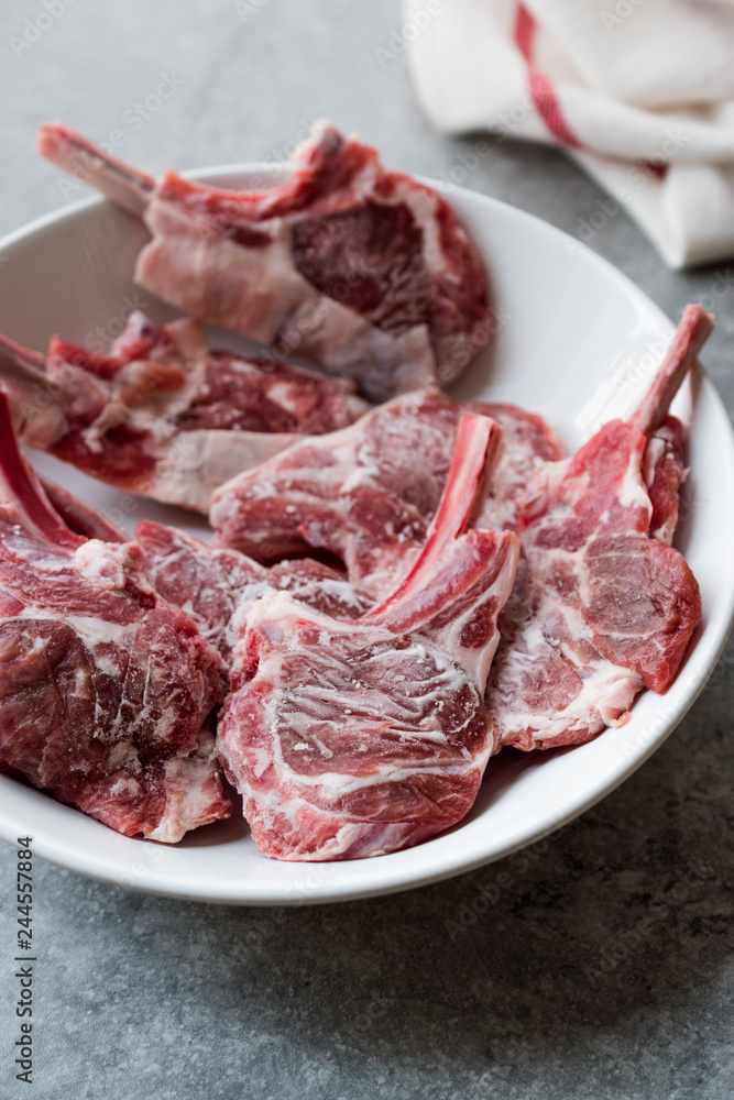 Raw Frozen Bloody Lamb Chops Meat in Plate