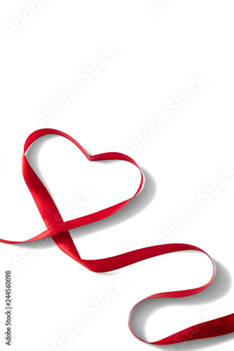 Heart shaped red ribbon for Valentine's day celebration on an isolated white background
