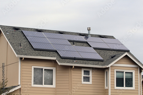 Home in Residential Area with Solar Panels on Roof