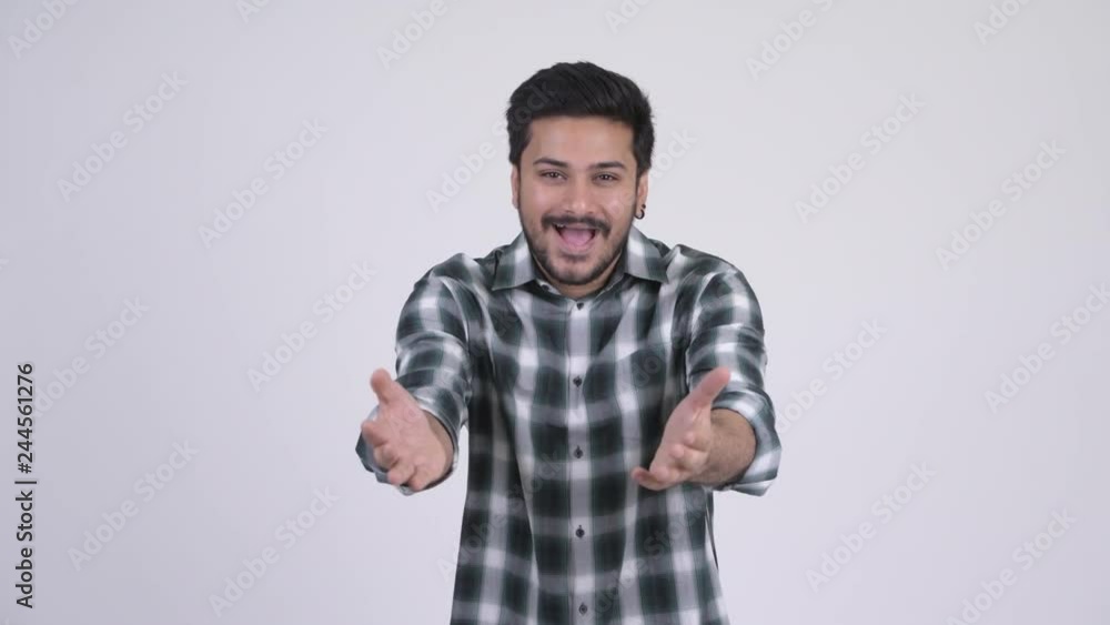 Young happy bearded Indian man with surprise gesture Young happy bearded Indian man with surprise gesture