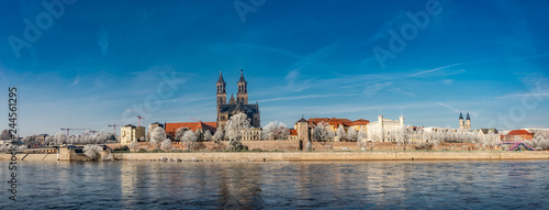 Panoramic view of first frost over amazing sunrise in Magdeburg downtown in Winter, Germany, sunny day, morning