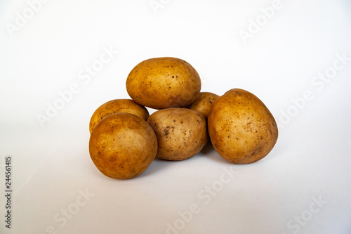 White ecological and very tasty raw potatoes for dishes and cuisine