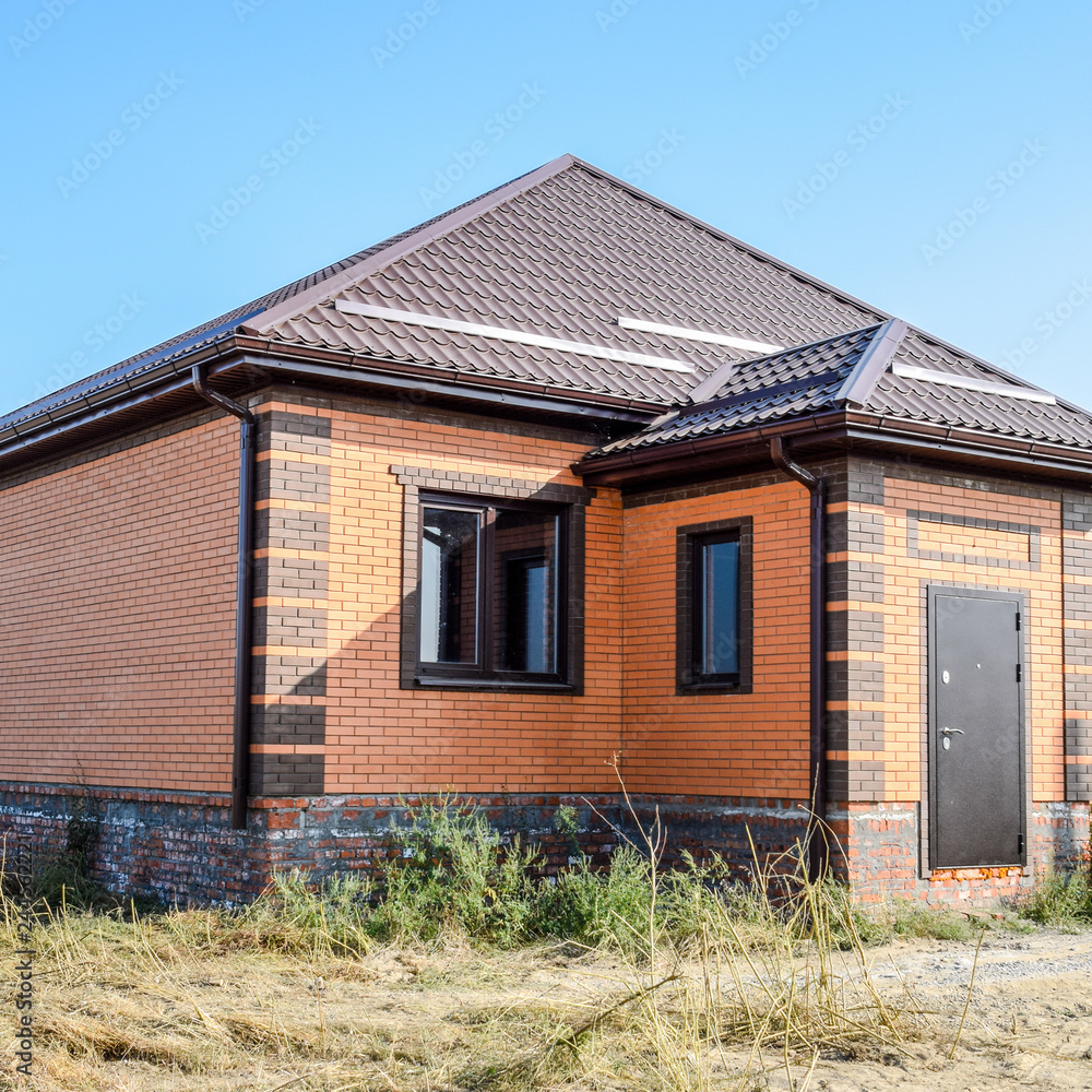 The house with plastic windows and a roof of corrugated sheet. R The house with plastic windows and a roof of corrugated sheet. R