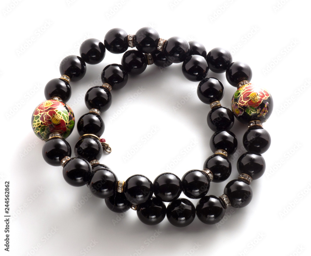 Two bracelets with black beads on a white background Two bracelets with black beads on a white background