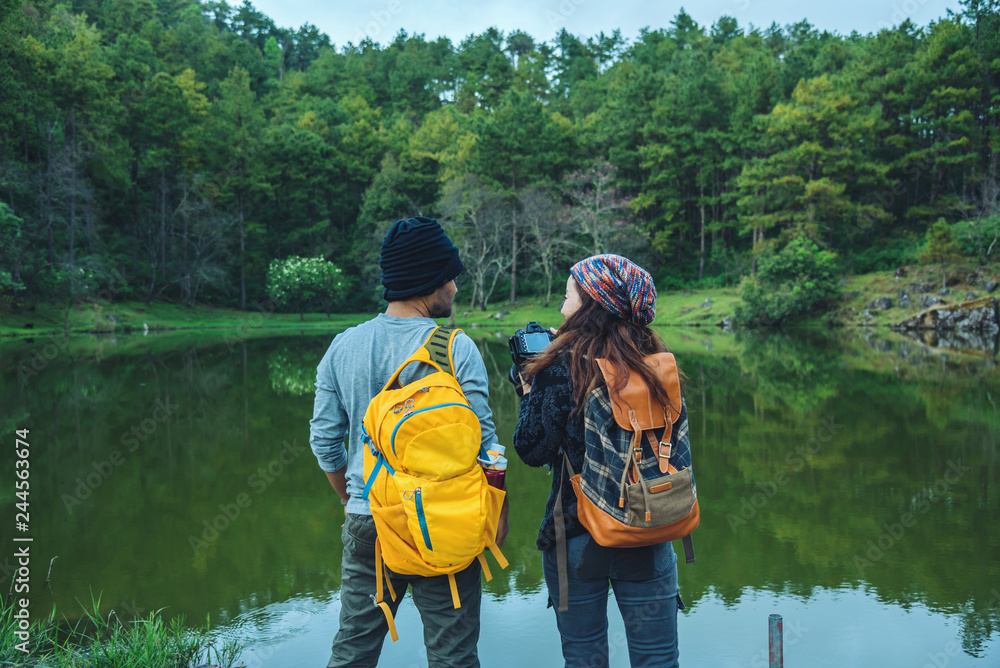 Lovers travel to watch the cherry trees of Asian couples. Happy with honeymoon travel,valentines. Lovers travel to watch the cherry trees of Asian couples. Happy with honeymoon travel,valentines.
