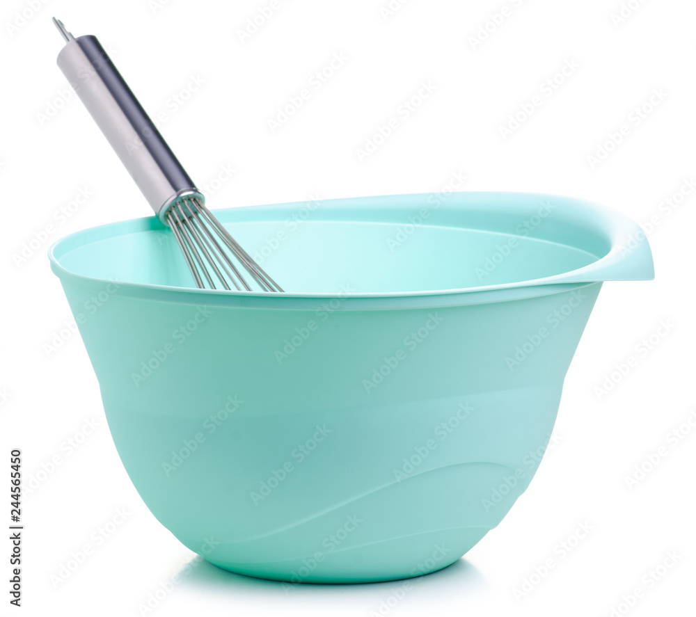 Green bowl and kitchen whisk corolla on white backgrund isolation Green bowl and kitchen whisk corolla on white backgrund isolation