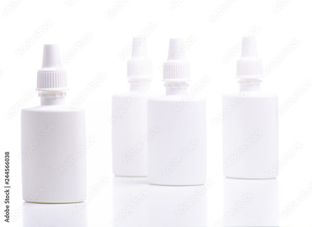 White bottles nose spray on white background isolation White bottles nose spray on white background isolation