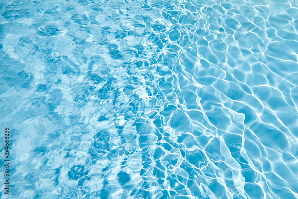 water surface in swimming pool with sun reflection, ripple, abstract background