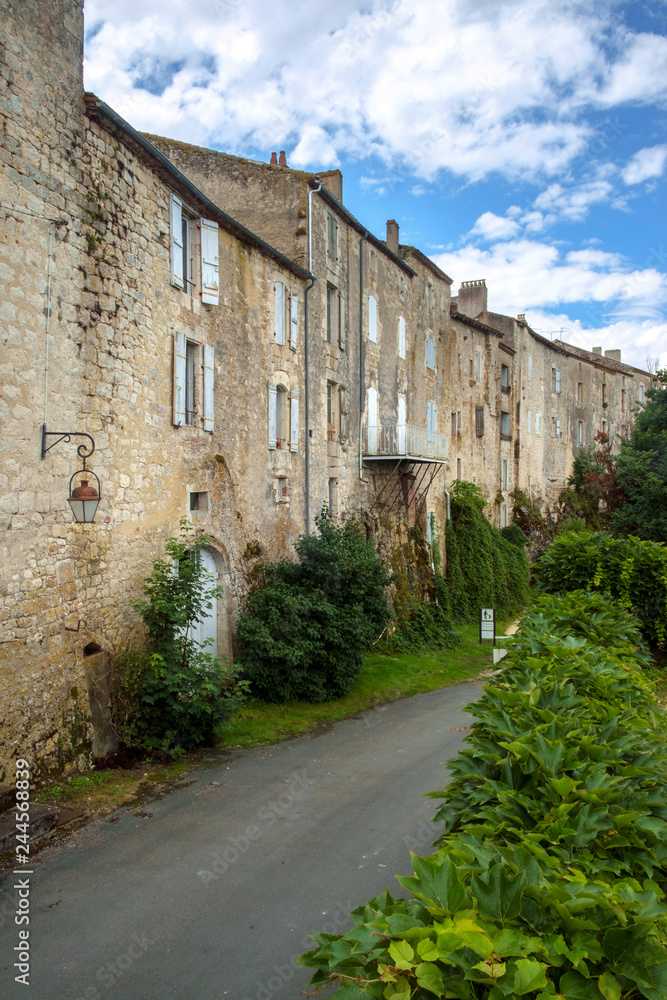 The massive walls of historic homes in the 'bastide' town of Tournon d'Agenais, Lot et Garonne, France