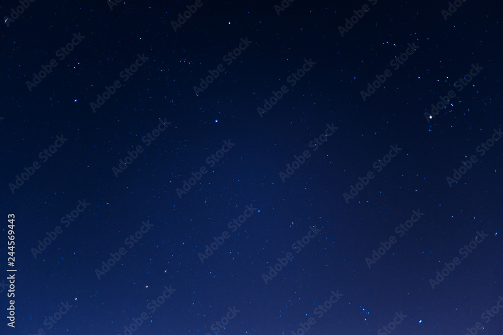 Long exposure night sky stars photo. A lot of stars with constellations. Far from the city. Night landscape.