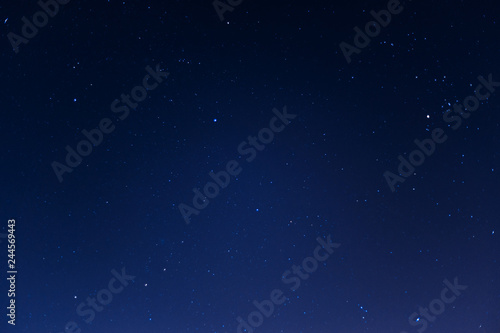 Long exposure night sky stars photo. A lot of stars with constellations. Far from the city. Night landscape.