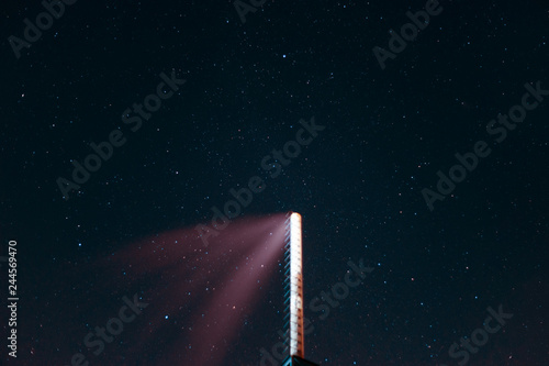 Long exposure night sky stars photo. Boiler tube on foreground. A lot of stars with constellations. Far from the city. Night landscape. photo