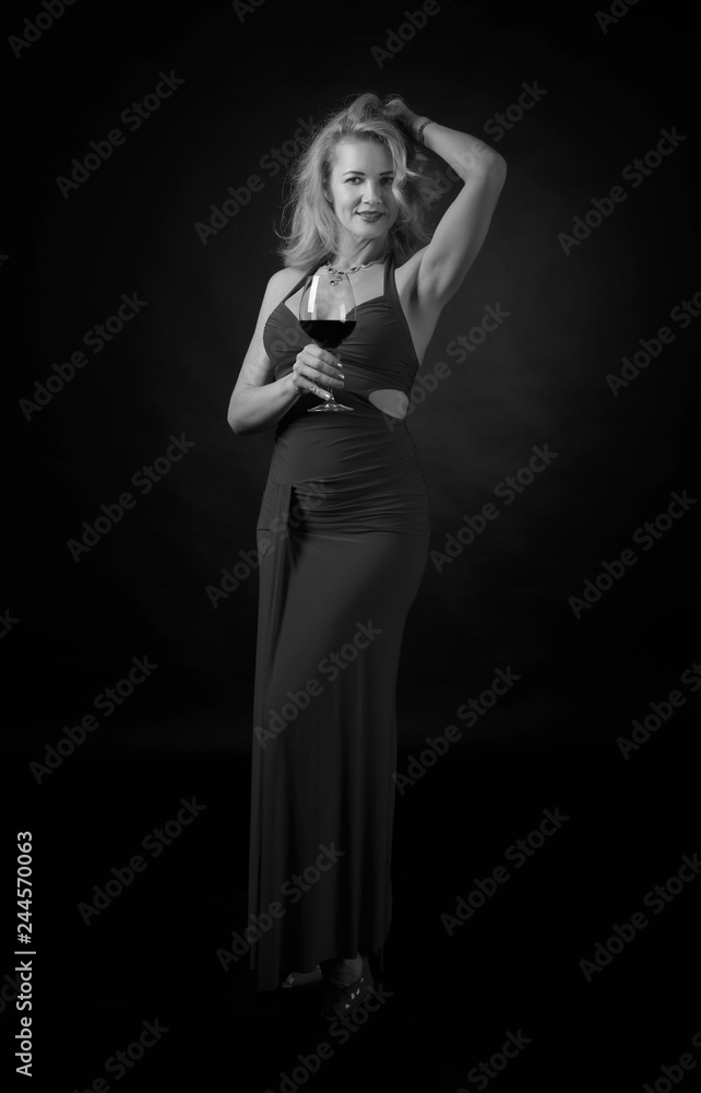Attractive middle age woman in evening dress. Attractive middle age woman in evening dress.