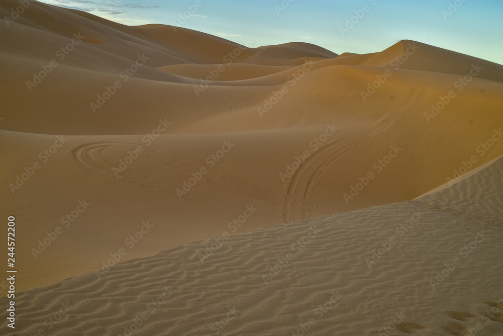 sunrise walk in sand dunes, Imperial Sand Dunes, California, USA