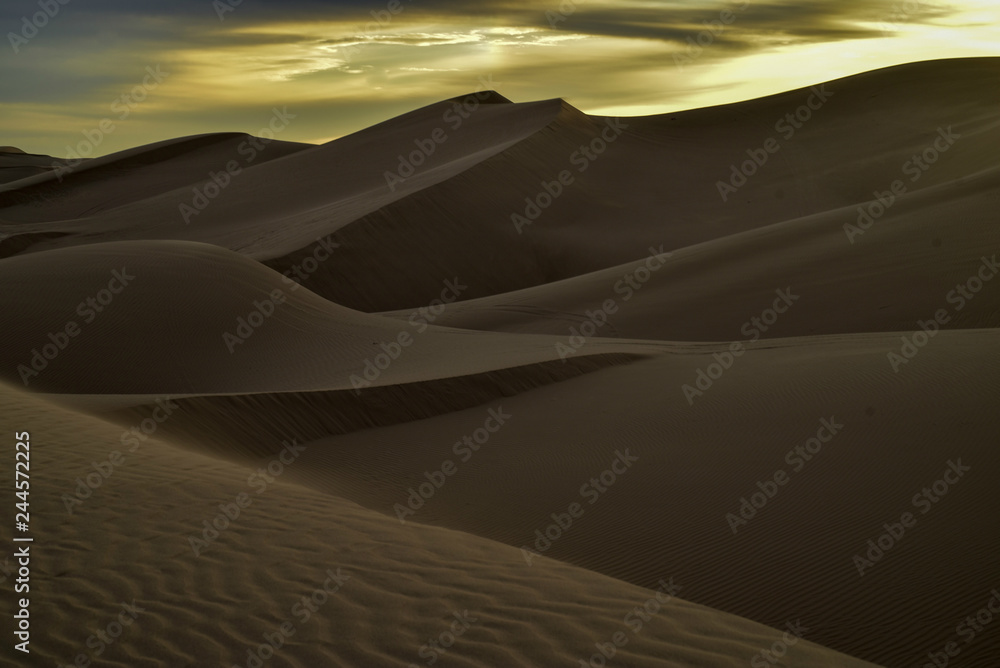 sunrise walk in sand dunes, Imperial Sand Dunes, California, USA