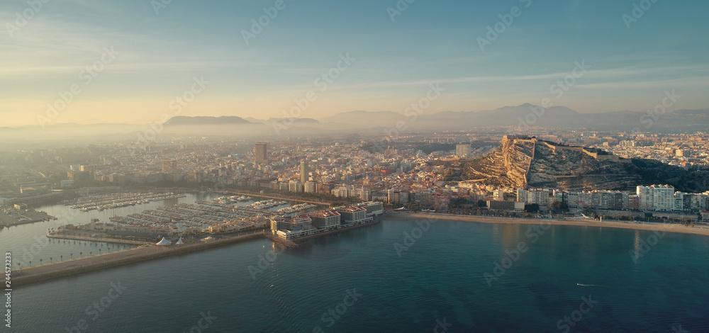 Aerial waterside photography drone point view Alicante cityscape. Spain