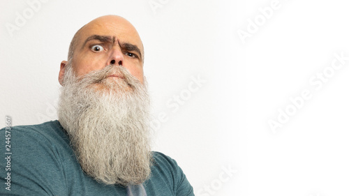 skeptical looking bearded man
