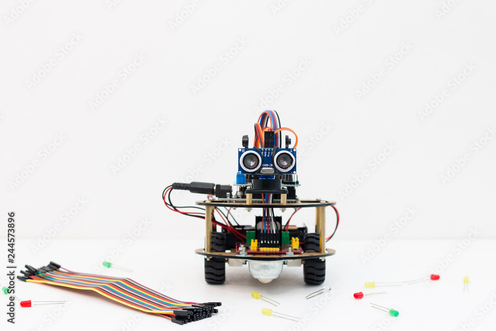 Hand made robot working on the arduino platform. White background. Free ...