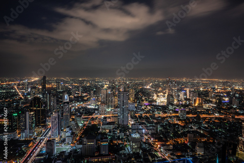 ฺNight scene of Bangkok cityscape with skyscraper and curve of Chao Praya river in the far background with Bokeh effect for nightlife concept / Cityscape concept / Nightlife © Nut
