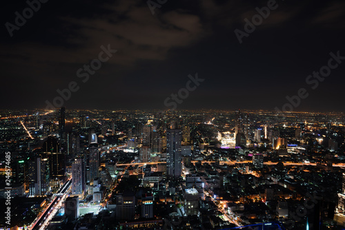 ฺNight scene of Bangkok cityscape with skyscraper and curve of Chao Praya river in the far background with Bokeh effect for nightlife concept / Cityscape concept / Nightlife