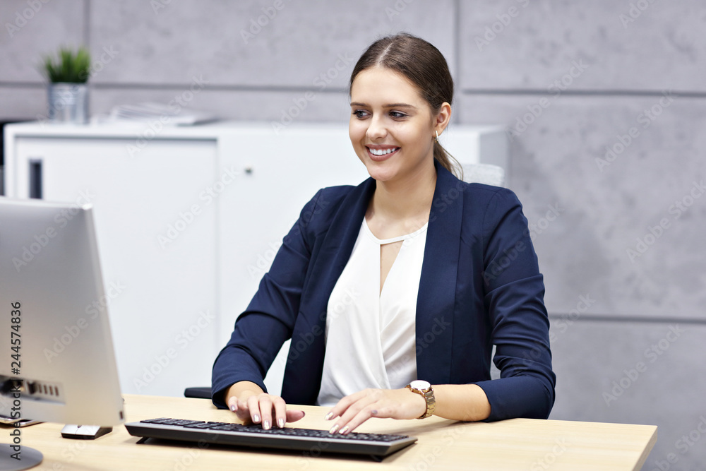 Close up portrait of attractive smiling businesswoman at workplace Close up portrait of attractive smiling businesswoman at workplace