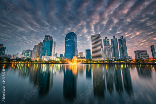 Cityscape image of Benchakitti Park at twilight time in Bangkok, Thailand. © nuttawutnuy