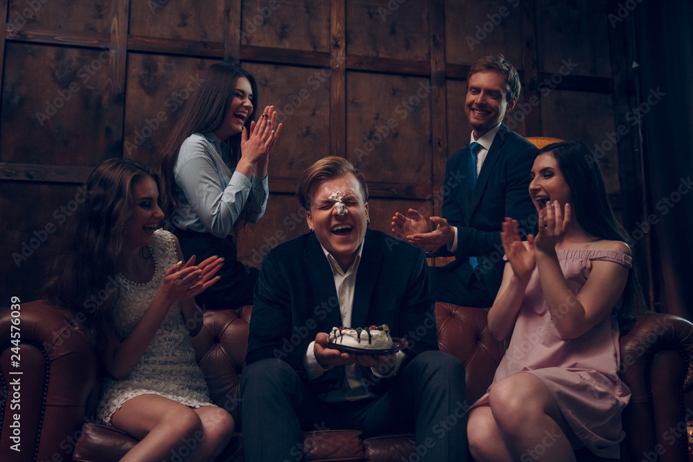 Handsome man's face covered in birthday cake Handsome man's face covered in birthday cake
