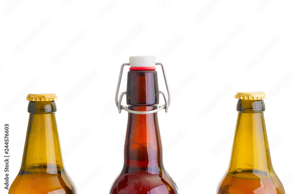 Three beer bottles close up on white background Three beer bottles close up on white background