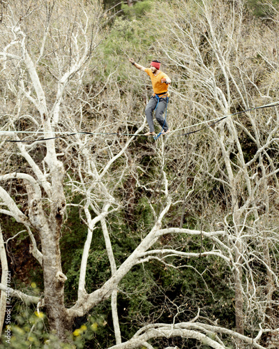 Wallpaper Mural Highliner on a rope. Highline on a background of mountains. Extreme sport on the nature. Balancing on the sling. Equilibrium at altitude. Torontodigital.ca