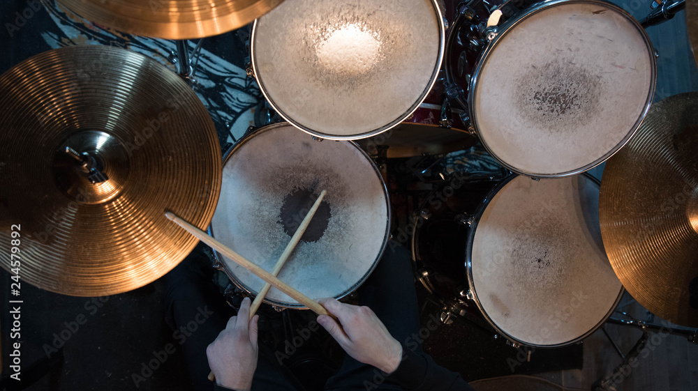 Professional drum set closeup. Drummer with drumsticks playing drums